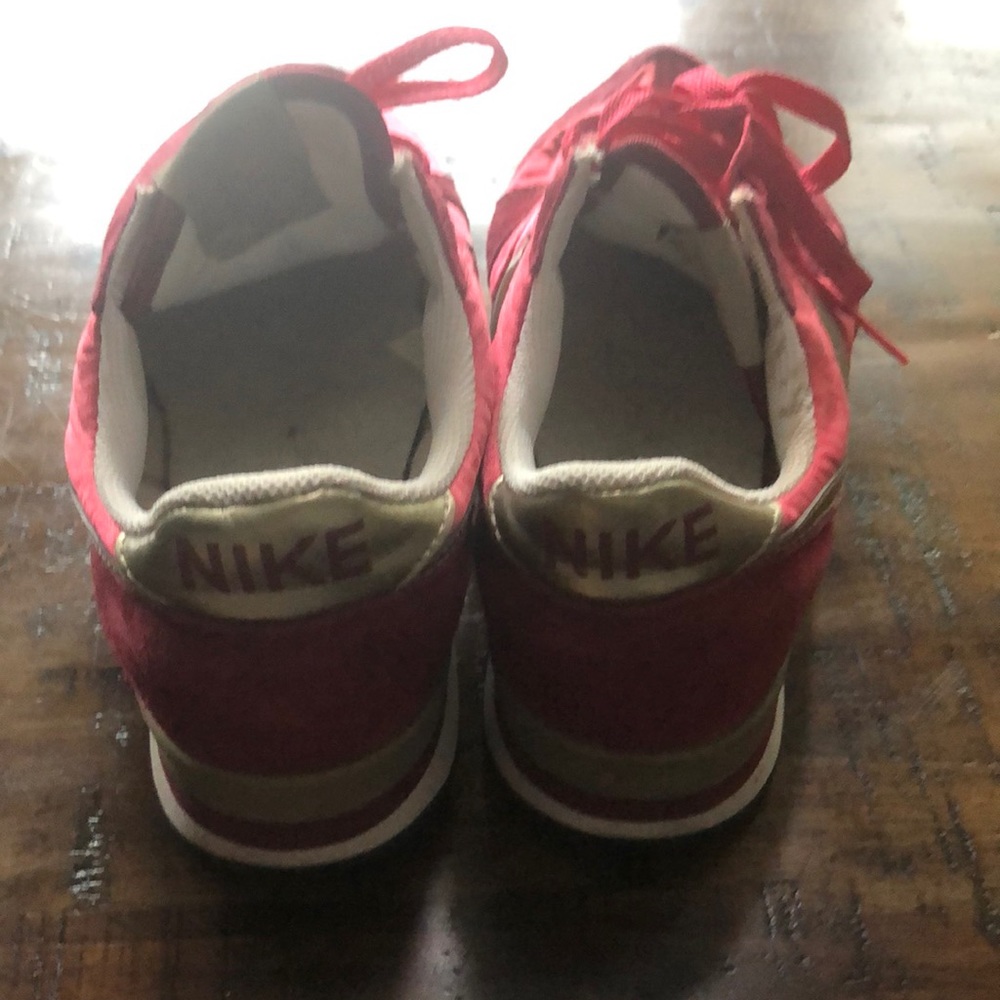 Women’s red and gold nikes